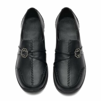 Top view of black leather loafers with decorative metal buckles.