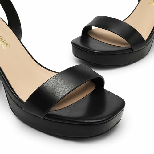 Black platform sandals with ankle strap.