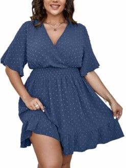 Woman wearing a blue wrap dress with polka dots