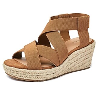 Brown strappy wedge sandal with espadrille sole.