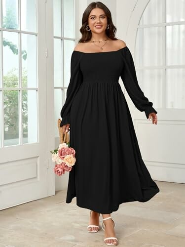 Woman in elegant black off-shoulder dress holding flowers, demonstrating the dress's versatility.