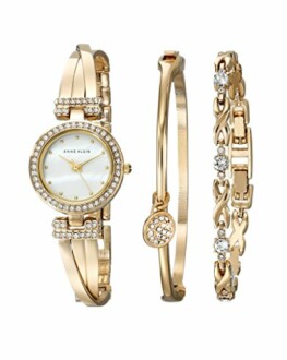 Gold watch and bracelet set with crystal accents.