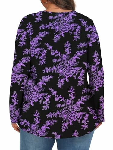 Back view of a black blouse with purple floral pattern