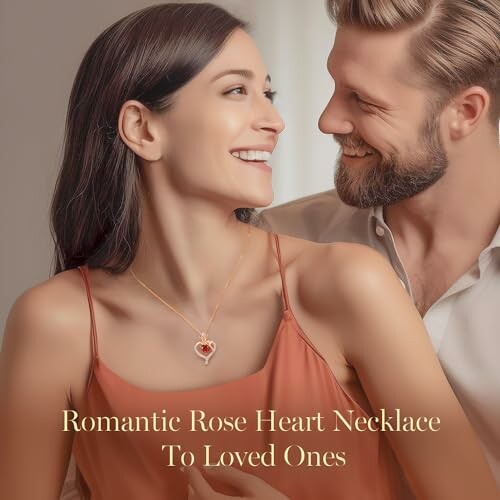 Couple smiling with a rose heart necklace.