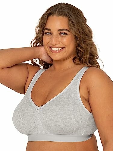 Smiling woman wearing a grey bra