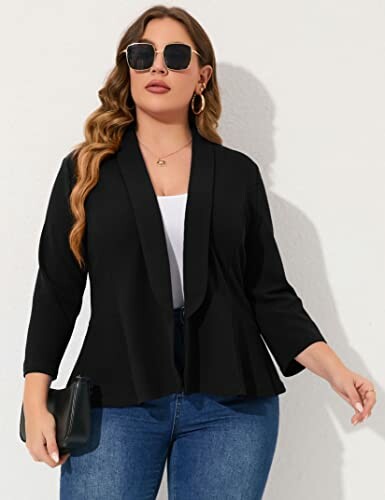 Woman wearing a black blazer, sunglasses, and holding a clutch.