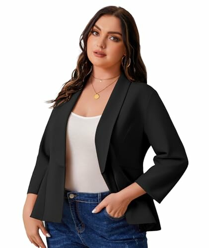 Woman wearing a black blazer and blue jeans