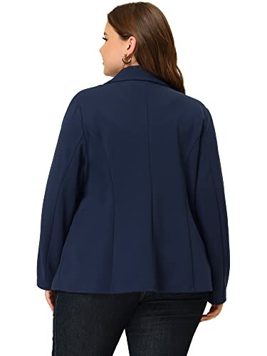 Woman wearing a navy blazer, back view