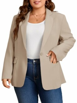 Woman wearing a tan blazer with a white top and jeans.