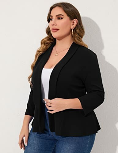 Woman in black blazer with white top and jeans