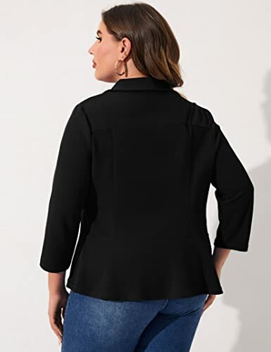 Woman in black blazer with three-quarter sleeves