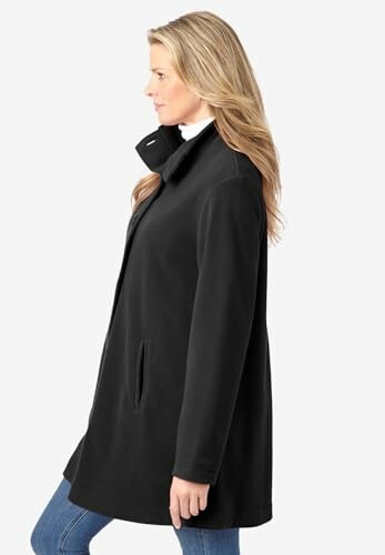 Woman in black coat with side profile.