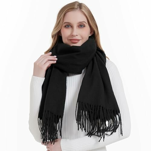 Woman wearing a large black scarf.