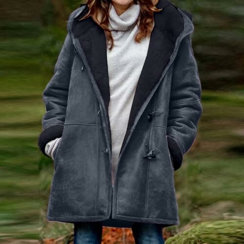 Woman in gray coat outdoors, showcasing the stylish design of the Plus Size Winter Coat.