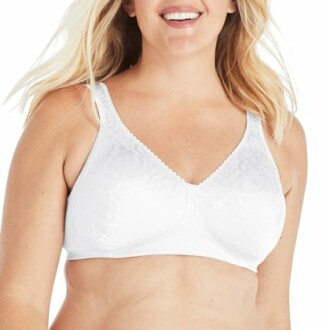 Woman wearing a white bra and smiling