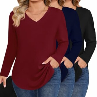 Three women wearing casual V-neck tops in red, blue, and black.